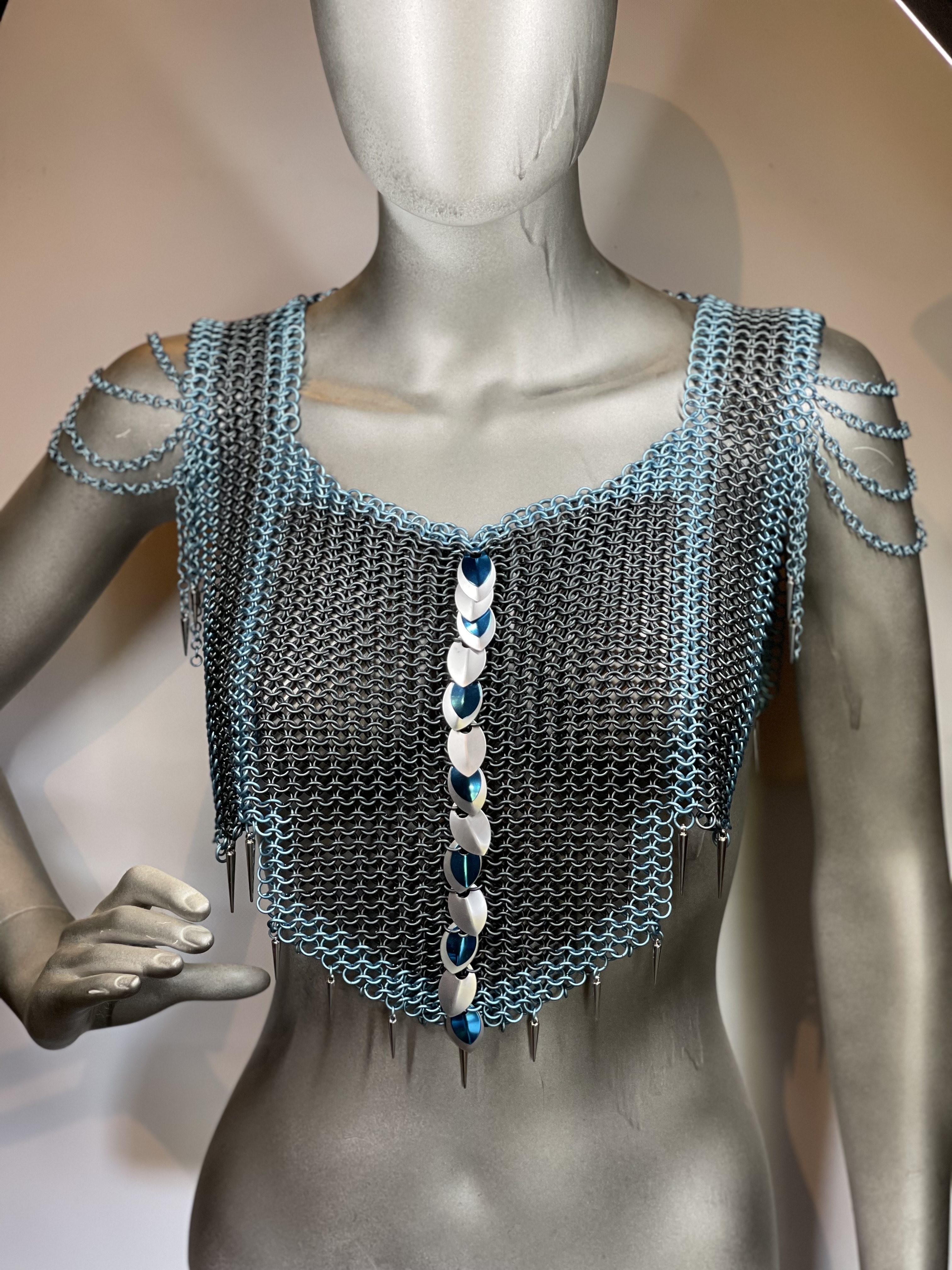 “European 4-in-1 chainmaille necklace in grey with light blue accents and silver and blue dragon scale shoulders, named Winterborne—handcrafted for icy fantasy elegance.”