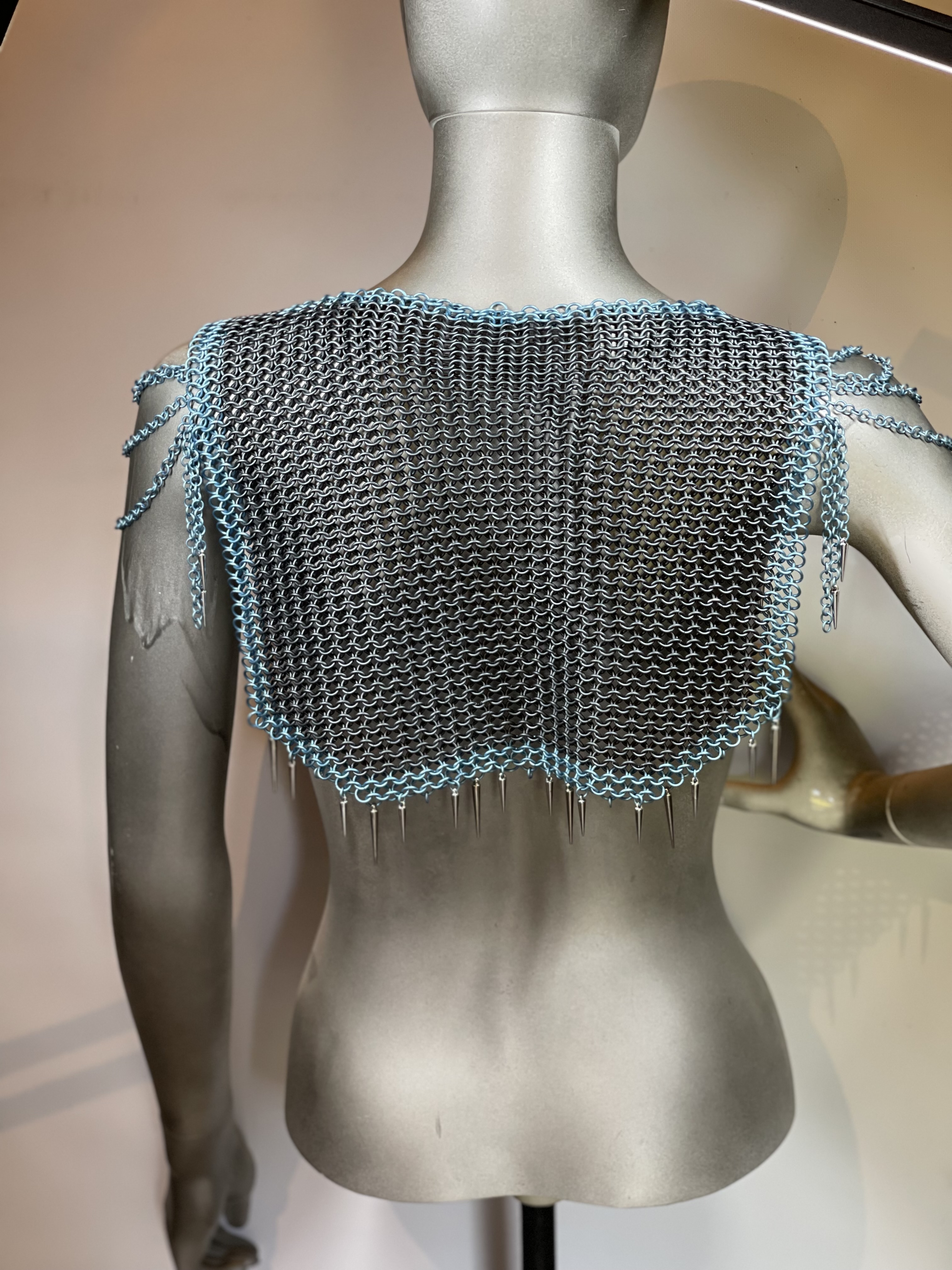 “European 4-in-1 chainmaille necklace in grey with light blue accents and silver and blue dragon scale shoulders, named Winterborne—handcrafted for icy fantasy elegance.”