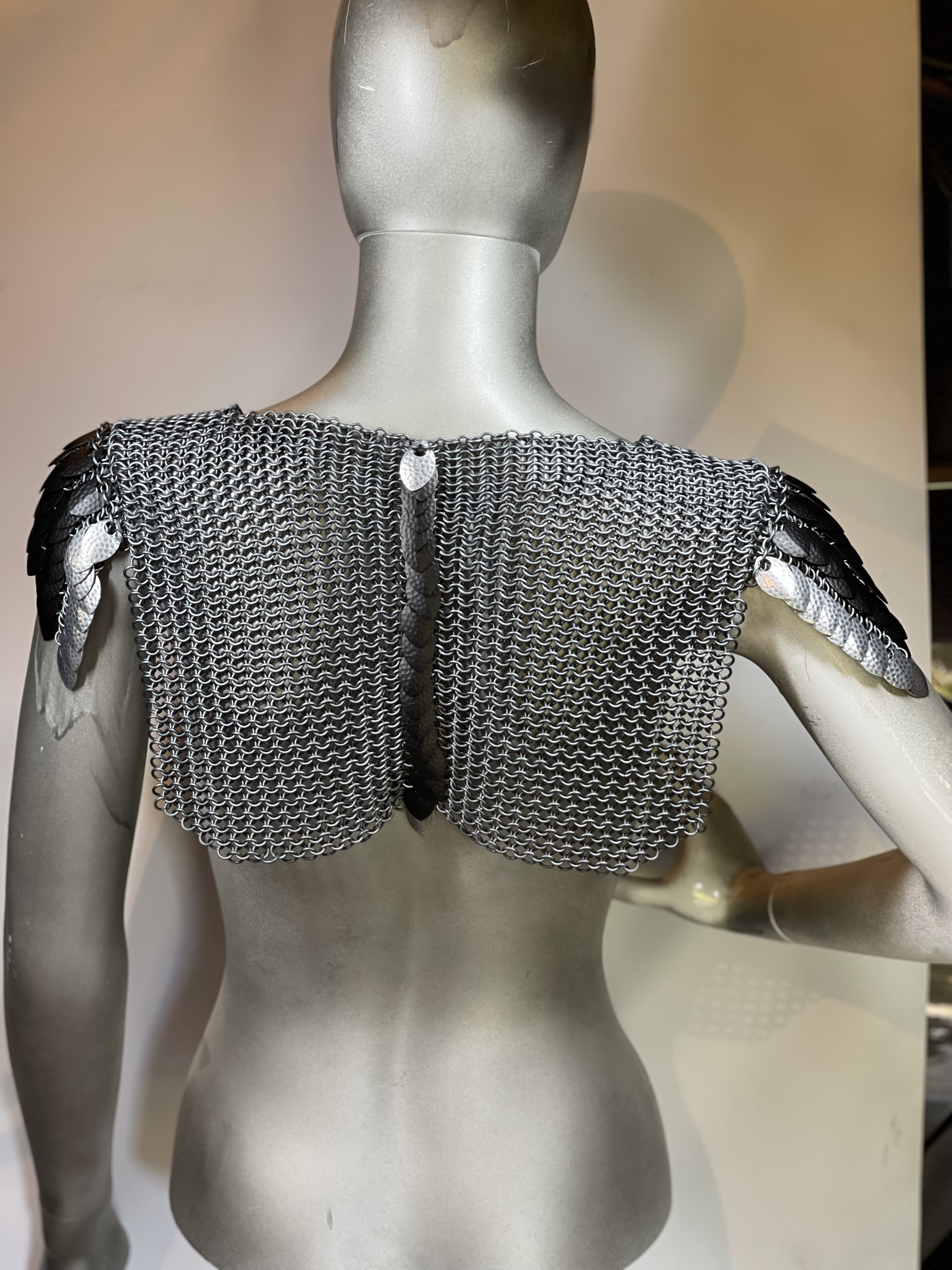 Dark grey chainmaille top with black and silver dragon scales, styled for fantasy cosplay or character armor