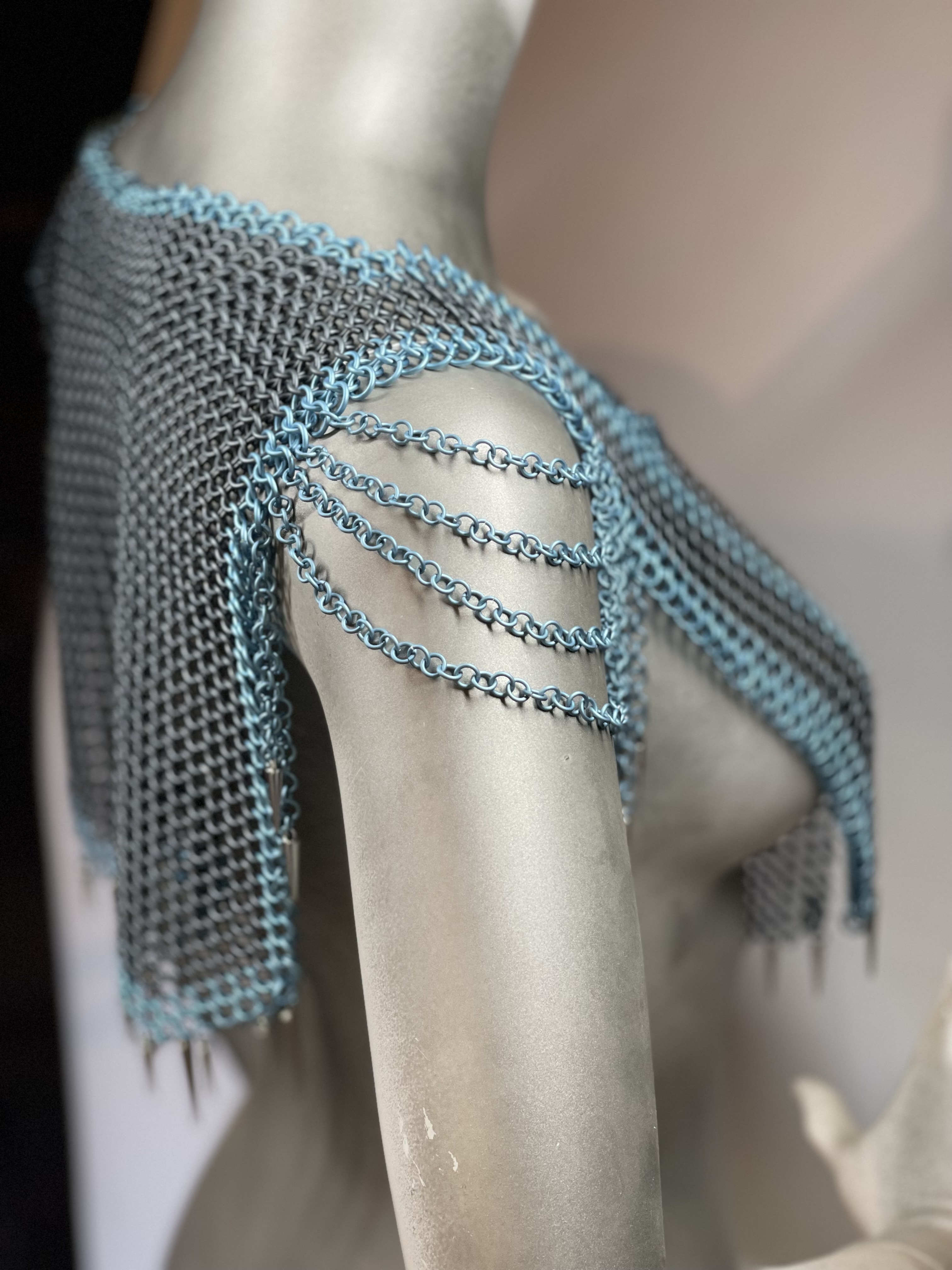 “European 4-in-1 chainmaille necklace in grey with light blue accents and silver and blue dragon scale shoulders, named Winterborne—handcrafted for icy fantasy elegance.”